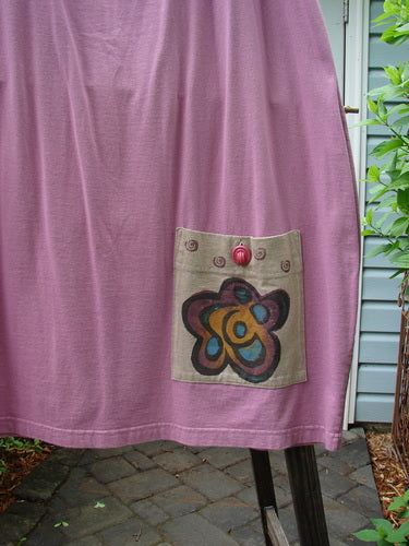 Image alt text: "1997 Big Pocket Skirt with flower design, drawstring waistline, bell-shaped bottom, and giant exterior pocket. Medium weight organic cotton. Size 1. Length: 39 inches."