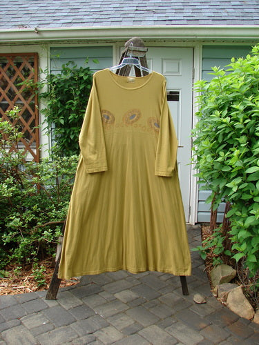 Image alt text: "1999 Curved A Line Dress Rolling Gold Size 1 - Long dress on a clothes rack with a plant in the background"