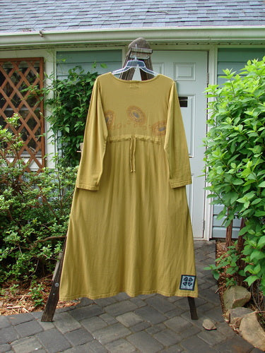 1999 Curved A Line Dress Rolling Gold Size 1: A yellow dress on a swinger, made from organic cotton. Features include a yoked waistline, deep side pockets, and a big bottom flair.