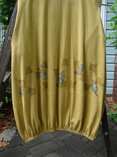 A yellow skirt on a rack, part of the 2000 Cotton Hemp Libby Jumper Fall Leaf Gold Size 1 collection.
