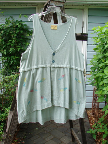 Barclay Little Tree Vest Dragonfly Fish Cucumber Size 1: A white shirt with fish designs on it, featuring a scoop front hemline, deep V neckline, and wooden button front.