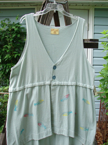 Barclay Little Tree Vest Dragonfly Fish Cucumber Size 1: A white shirt with fish designs on it, featuring a scoop front hemline, deep V neckline, and wooden button front.