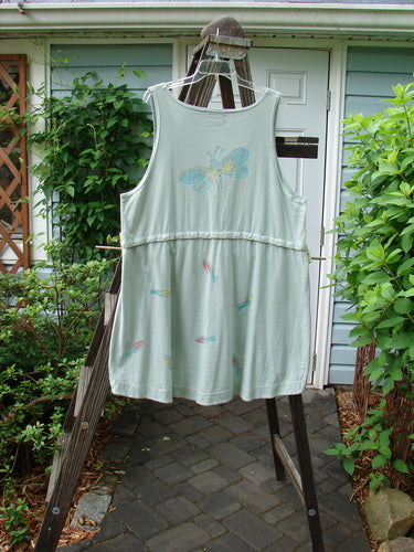 Barclay Little Tree Vest Dragonfly Fish Cucumber Size 1: A cropped vest with a deep V neckline, wooden button front, and abundant dragonfly fish paint.