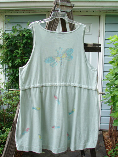 Barclay Little Tree Vest Dragonfly Fish Cucumber Size 1: A white vest with a dragonfly fish design, featuring a scoop front hemline, deep V neckline, and wooden button front.