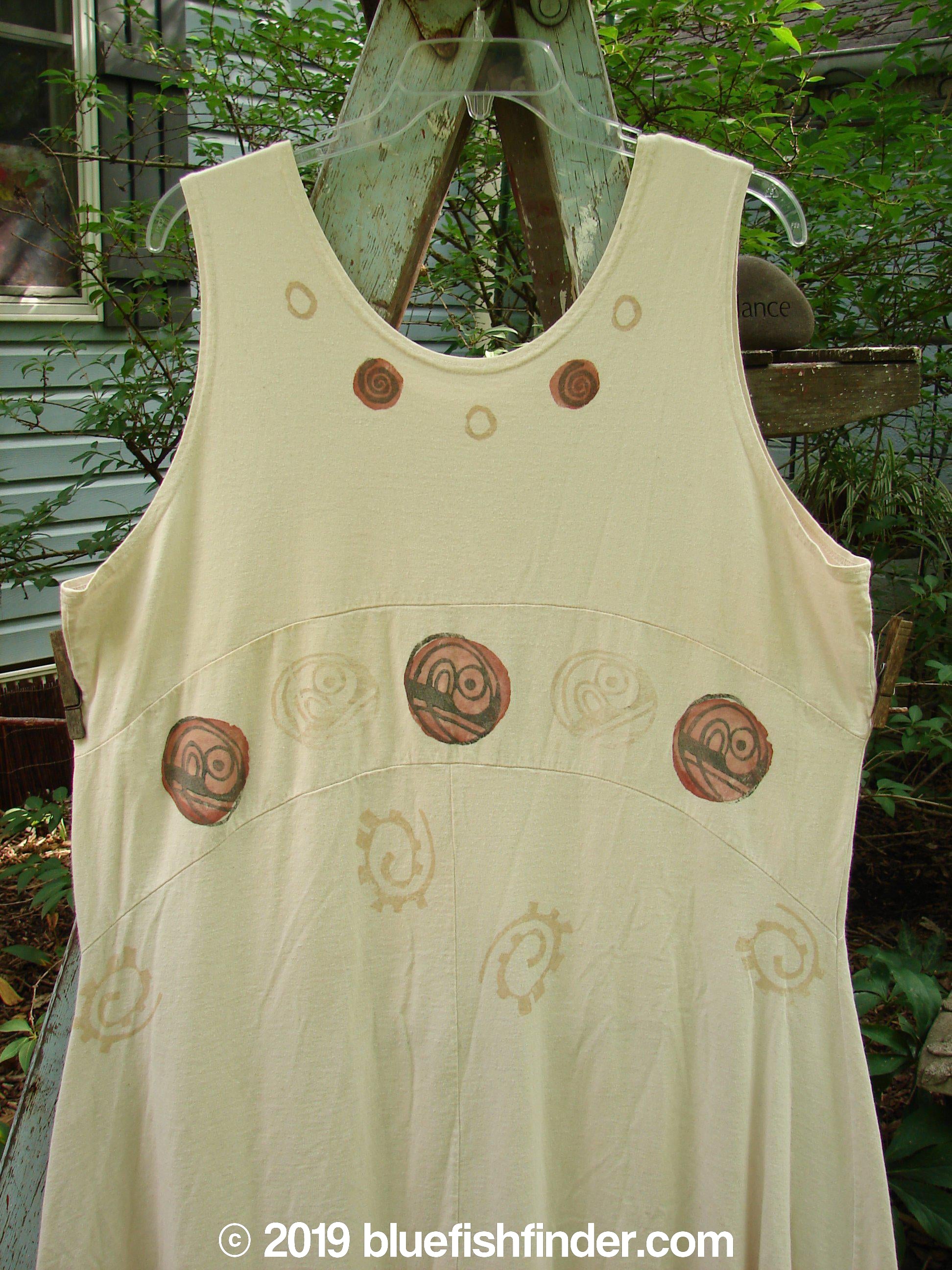 1995 Zelda Jumper Dress Abstract Champagne Size 2: A white dress with brown circles, featuring a deeper scooped neckline and an A-line shape.