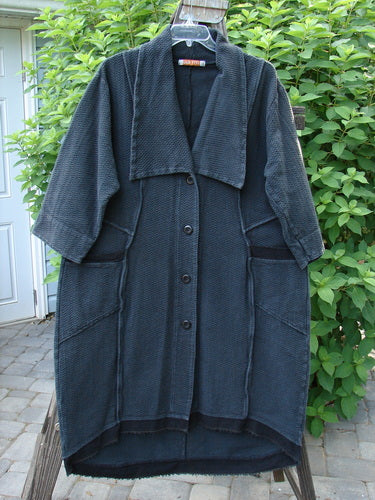 Image alt text: Barclay Thatch Big Collar Coat Unpainted Deep Forest Size 1 - A long black coat with an oversized foldable collar, dense knit texture, and interesting stitchery.