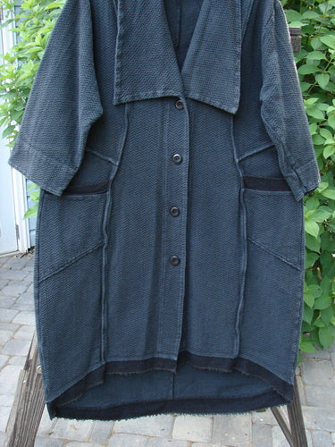 A black Barclay Thatch Big Collar Coat with dense knit fabric, oversized foldable collar, exterior stitchery, drop front pockets, V-stitched upper back seams, cuffed lower sleeves, and a four-button closure. Size 1.