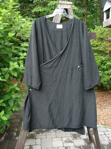 2000 Shaunting Silk Smooth Slant Wrap Jacket Unpainted Black Size 2: A black dress on a clothes line, with wider rounded sleeves and a slanted gathered rear back center seam.