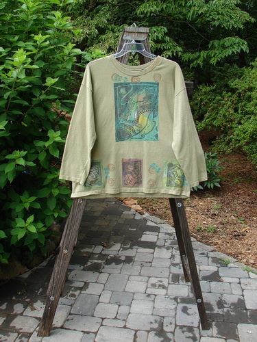 Image alt text: 1992 Long Sleeved Tee with Fancy Boot Paint, Rosemary OSFA, on a swinger, tree in background
