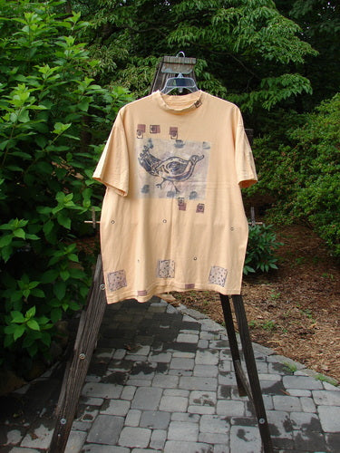 Image alt text: 1991 Short Sleeved Tee with Chicky Paint Design on Marigold Background