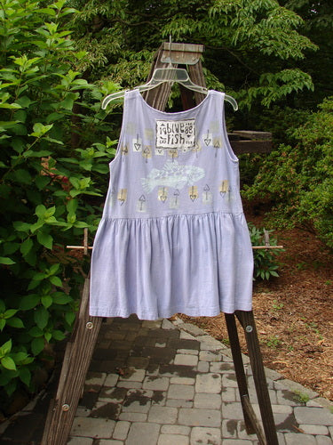 Image alt text: 1990 Tiny Tier Top Fish Clover Tiny OSFA - A cute vintage dress with a fish theme, featuring a deep rounded neckline and a bottom flounce.