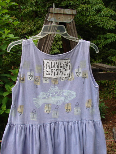 1990 Tiny Tier Top Fish Clover Tiny OSFA: A purple tank top with fish on it. Smaller shape and arm openings. Deep rounded and rolled neckline with a super bottom flounce. Perfect for a Tiny Adult.