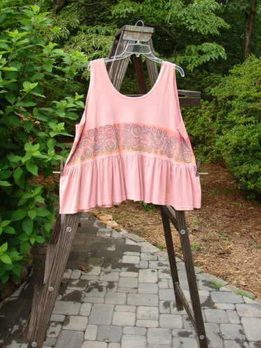 1992 Peplum Top with a wide waist and a gathered bottom flounce, in Pink Clover, perfect for layering.