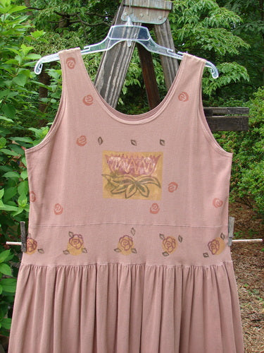 1993 Tier Dress Water Lilly Dried Rose Size 2: A pink dress with a flower design, banded drop waistline, and bottom flounce. Perfect condition and made from cotton.