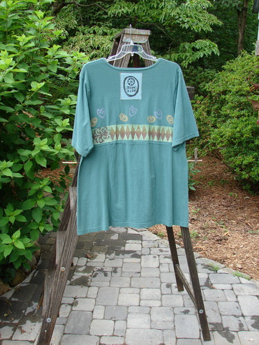 1993 3 Square Dress with Multi Diamond pattern on Grey Green fabric, featuring a rounded neckline, six sectional panels, and a slight empire waist seam.
