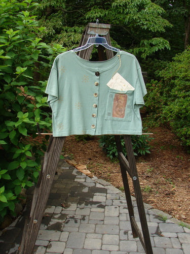 1994 NWT Song Top Mandolin Aloe Size 1: Green shirt on clothes rack with pocket and buttons