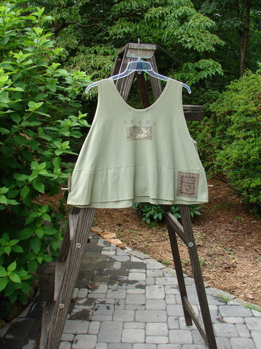 1995 Klee Top Single Beetle Time Marsh Size 1 displayed on a swinger, showcasing its A-line crop shape, scooped neckline, and unique Blue Fish Patch, capturing its playful and collectible essence.