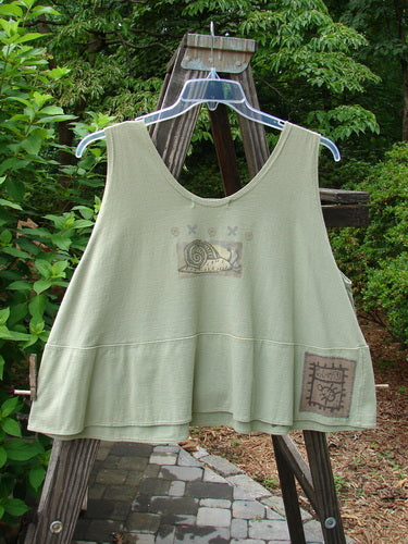 1995 Klee Top Single Beetle Time Marsh Size 1 displayed on a swinger, showcasing its unique A-line crop shape, scooped neckline, and decorative beetle garden theme paint.