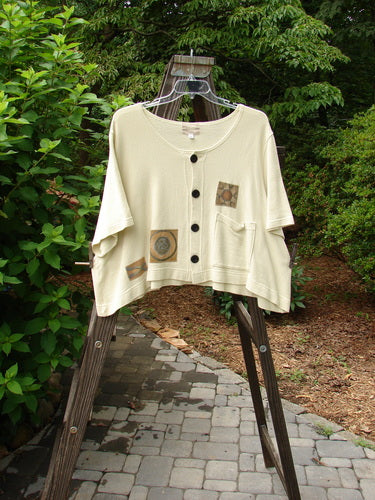 2000 Patched Recycle Jacket Science Natural Size 2: A white shirt with a patchwork design on a swinger, featuring a cool front squared drop pocket and neat recycled buttons.