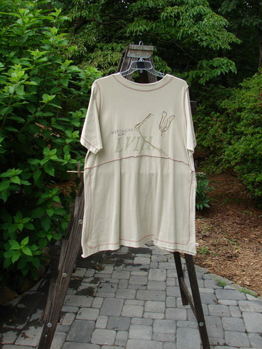 1998 Botanicals Snapdragon Top Echinacea Toadstool Size 2: A t-shirt with a graphic design on a clothes rack.