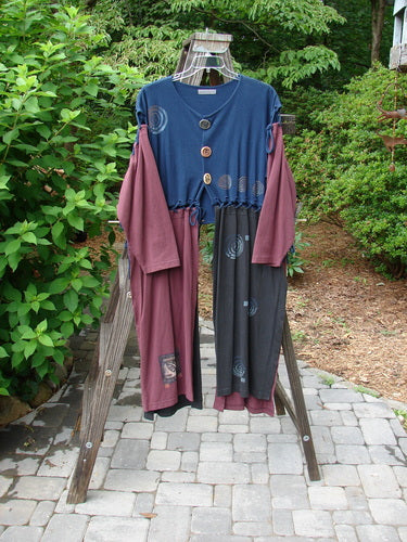 1997 Strapwork Jacket Vest Celtic Spin Window Pane OSFA: A clothes rack with a blue and pink pants and a blue shirt, a close-up of a purple shirt, and long red and black dresses on a clothes line.