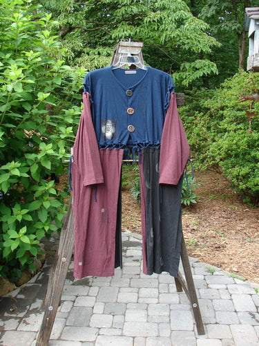 1997 Strapwork Jacket Vest Swirl City Multi OSFA: A clothes rack with a blue and pink shirt and pants.