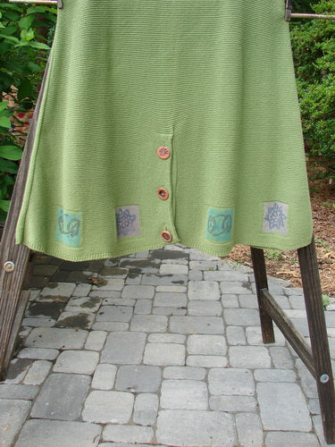 1994 Vent Vest Sweater Jumper Stars Kelp Smaller OSFA: A green skirt with buttons on it, made from cotton yarn. Features include a slenderizing A-line shape, rear walking vent, and whimsical star paint. Perfect for smaller fishers with a generous hip flair. Bust: 40, Waist: 44, Hips: 50, Hem Circumference: 72, Length: 38 inches.