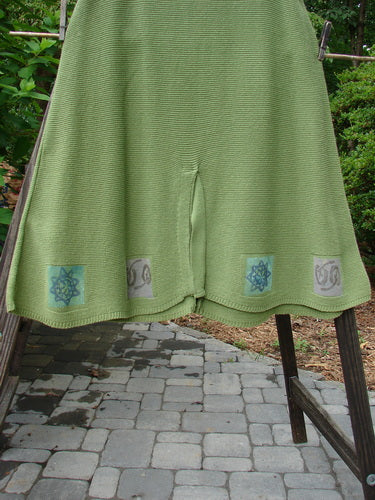 1994 Vent Vest Sweater Jumper Stars Kelp Smaller OSFA: A green sweater with designs on it, featuring whimsical star paint and a detailed hemline.