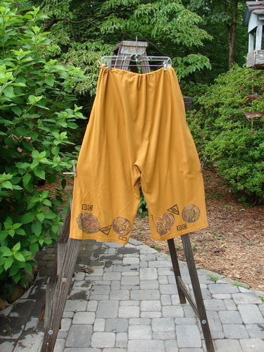 1993 Garden Pant Swirl Circle Oro Size 1: Funky crop pants with side ties, deep bushel pockets, and vintage swirl circle theme paint.
