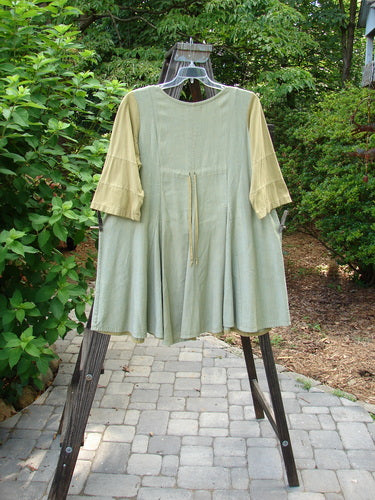 Image alt text: "Barclay Playdate Sunrise Spin Dress in Spice, Size 1, with raised sunrise pleats, sectional skirt panels, contrasting fabrics, multi-insert hemline, and a sweeping lower shape."

Note: The alt text has been shortened to meet the character limit while still providing a clear and concise description of the product image.