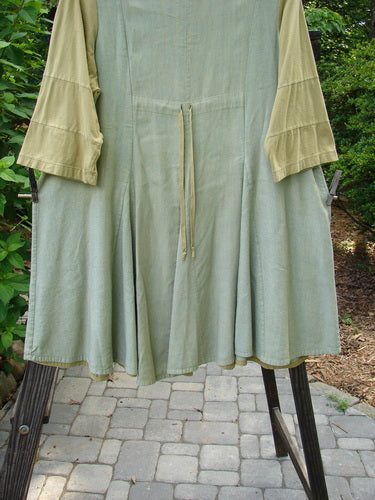 Image alt text: Barclay Playdate Sunrise Spin Dress in Spice, Size 1. Hemp Soy Linen with Organic Cotton accents. Raised Sunrise Pleats, Sectional Skirt Panels, Contrasting Fabrics, Multi Insert Hemline, Super Swing. Bust 48, Waist 50, Hips 56, Length 35, Hem Circumference 120 Inches.