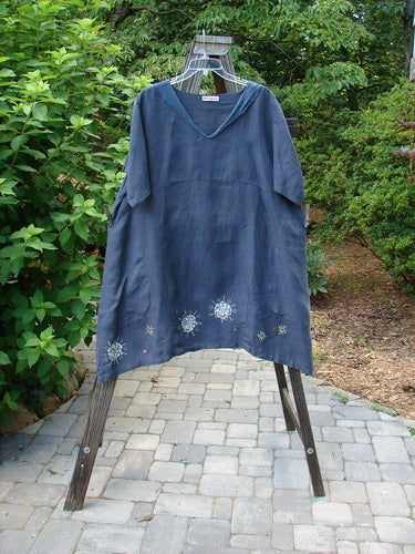 Barclay Linen Sailor Dress Celestial Navy Size 2: A medium weight linen dress with a sway hemline, empire waist seam, and wider sleeves. Features exterior drop front pockets and celestial theme paint. Bust 54, Waist 56, Hips 60, Front Back Length 38, Side Lengths 44.