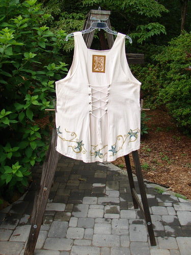 Image alt text: "1993 Cha Cha Jumper Starfish Teadye OSFA: A white shirt with laces and a lace-up back, featuring a squared off neckline, A-line flare, varying hemline, and gathered bust area."