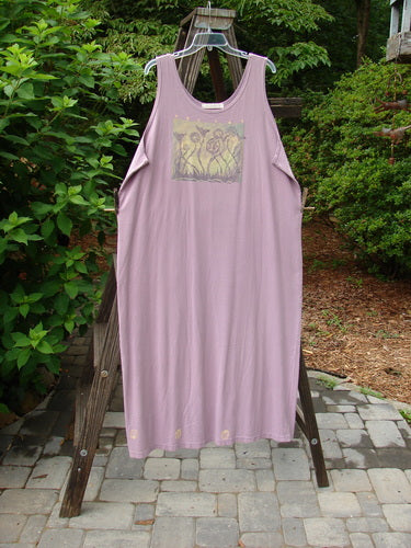 Image alt text: 1997 River Journey Dress in Jasmine, Size 2: A purple dress with a growth-themed paint design, scoop neckline, and deeper arm openings. Complete with the Blue Fish signature patch.