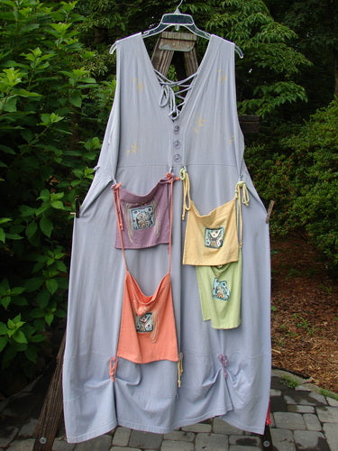 1997 Salt Water Taffy Jumper Rain Size 2: A dress on a wooden pole with rippie accents, front and back pockets, and ocean coral theme paint.