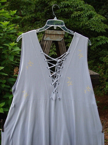 1997 Salt Water Taffy Jumper Rain Size 2: A grey dress with lacing on the back, featuring a mirror swinger and lace-up detail.
