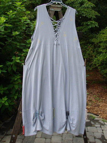 Image alt text: "1997 Salt Water Taffy Jumper Rain Size 2: A dress on a clothes line, featuring rippie accents, front and back pockets, and ocean coral theme paint."