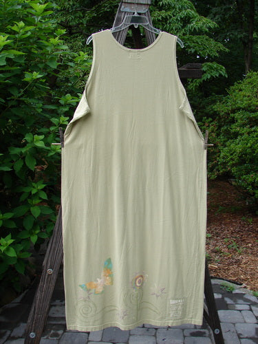 1999 River Journey Dress Butterfly Kelp Size 2: A white dress on a clothesline with a vibrant butterfly design, made from organic cotton.