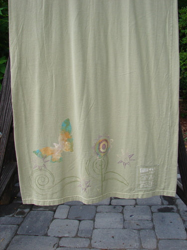1999 River Journey Dress Butterfly Kelp Size 2: A white towel with butterflies and flowers, featuring a vibrant butterfly theme paint.