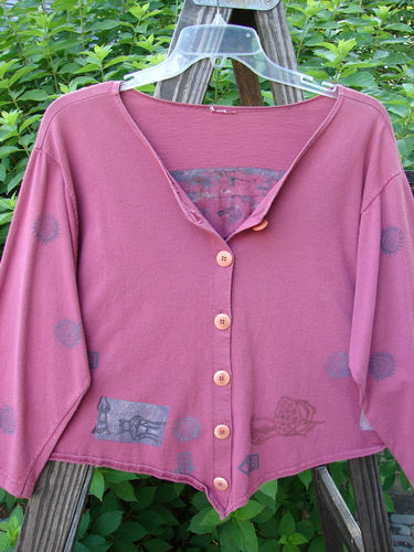 1994 Curve Shirt Studio Umeboshi Size 1: A pink sweater with pictures on it, featuring a V-shaped neckline and original Blue Fish buttons.
