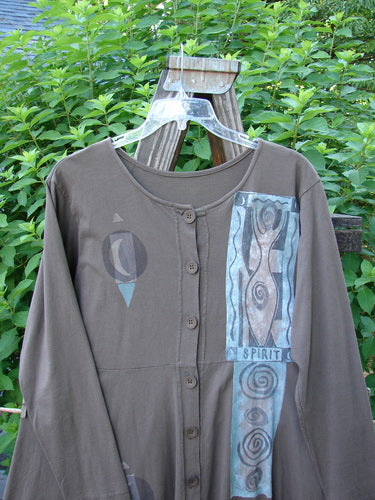 1994 Poppy Dress Collarless Figure Eight Woman Humus Size 2: A brown shirt with a design on it, featuring an empire waistline and a full, sweeping lower.