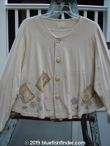 1999 Coffee Top Flowerpot Tea Dye Floral Size 2: A white sweater with a floral design, featuring a sweeping rounded hemline and a drawcord back.