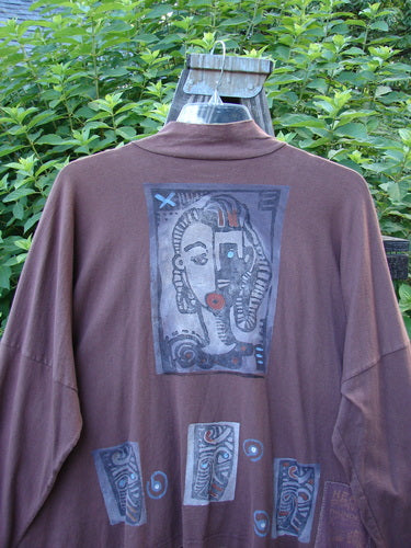 1996 Elements Mock T Neck Jacket Heart Spicewood OSFA: A brown shirt with a picture on it, featuring a close-up of a painting and a close-up of a metal object.