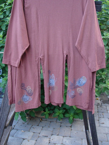 1994 Windmill Top Butterfly Clay Size 1: A pink shirt with a pattern of butterflies. Six-panel lower, wider neckline, and sectional panels front and back. Perfect with all the 1994 pieces!