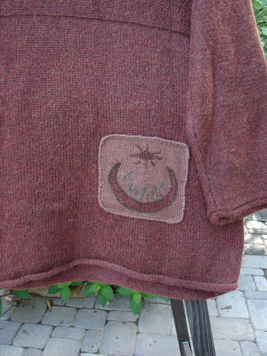 1998 Alpaca Patched Tunic Sweater: Close-up of knitted fabric with ribbed pattern and oversized nature patches.