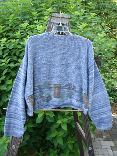 Image alt text: "1994 Crop Cardigan Sweater featuring leaf and pod design, in Haiku Blue Melange. Perfect One Size Fits All. Stoneware buttons, contrasting knits, V neckline, cozy longer sleeves. Bust 50, Waist 50, Length 19."