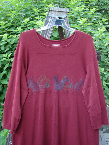 1999 Thermal Home Dress Farm Cinnamon Size 1: A red shirt with a picture on it, featuring a farm theme paint and unique sectional panels.