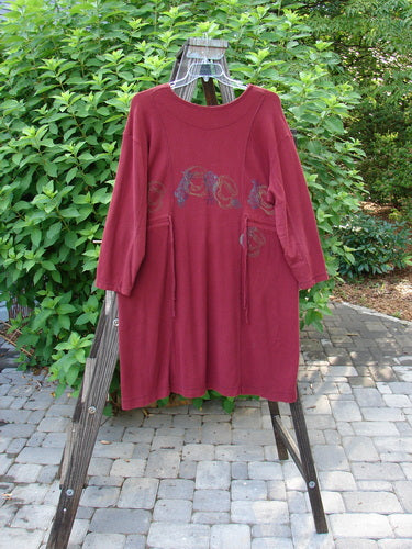 1999 Thermal Home Dress Farm Cinnamon Size 1: A red shirt with a pattern, featuring a unique neckline, elbow patches, and drawcords.
