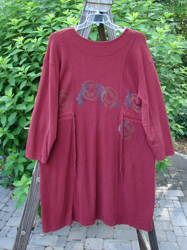 1999 Thermal Home Dress Farm Cinnamon Size 1: A red shirt with a design on it, featuring a unique sectional panel and a squared off neckline.