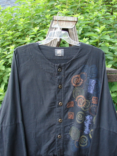 2000 Flannel Zantia Jacket Bubble Block Black Size 2: A black shirt with a swirl design on it, featuring ruffles, layers of whimsical paints, and a boxy square shape with a slight flare.